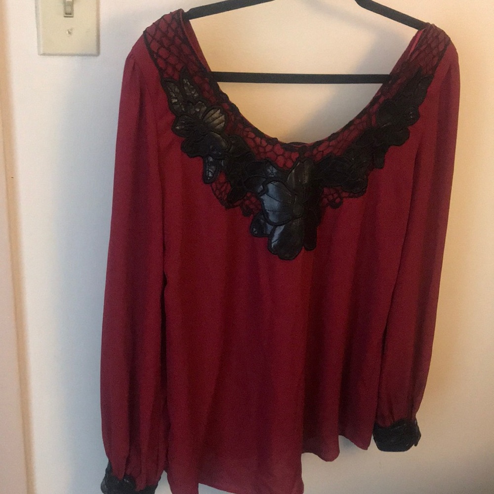 Red blouse with faux leather embellishments